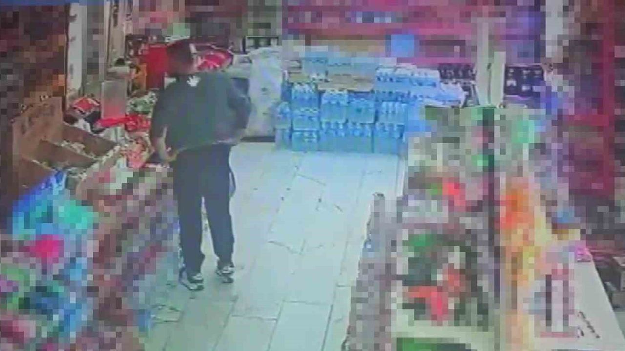 Adana'da market kasasından cep telefonu çalındı — güvenlik kamerası kaydetti