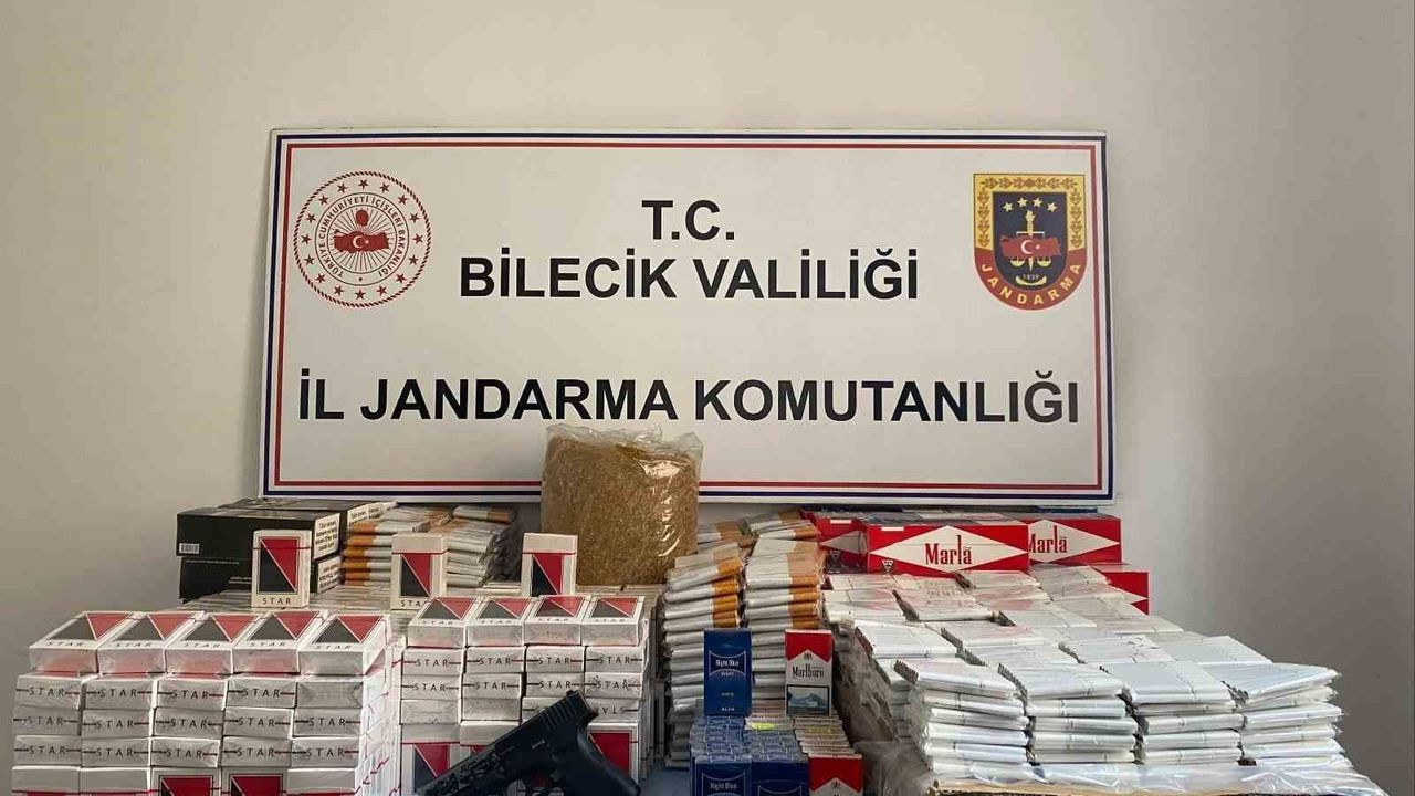 Osmaneli'de jandarma baskınında ruhsatsız silah ve kaçak tütün ele geçirildi