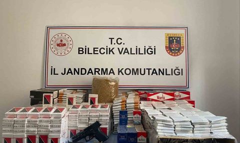 Osmaneli'de jandarma baskınında ruhsatsız silah ve kaçak tütün ele geçirildi