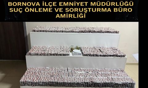 Bornova'da kapıcı dairesindeki zula: 29 bin 259 sentetik hap ele geçirildi